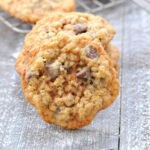 Stack of oatmeal scotchies on white wooden board