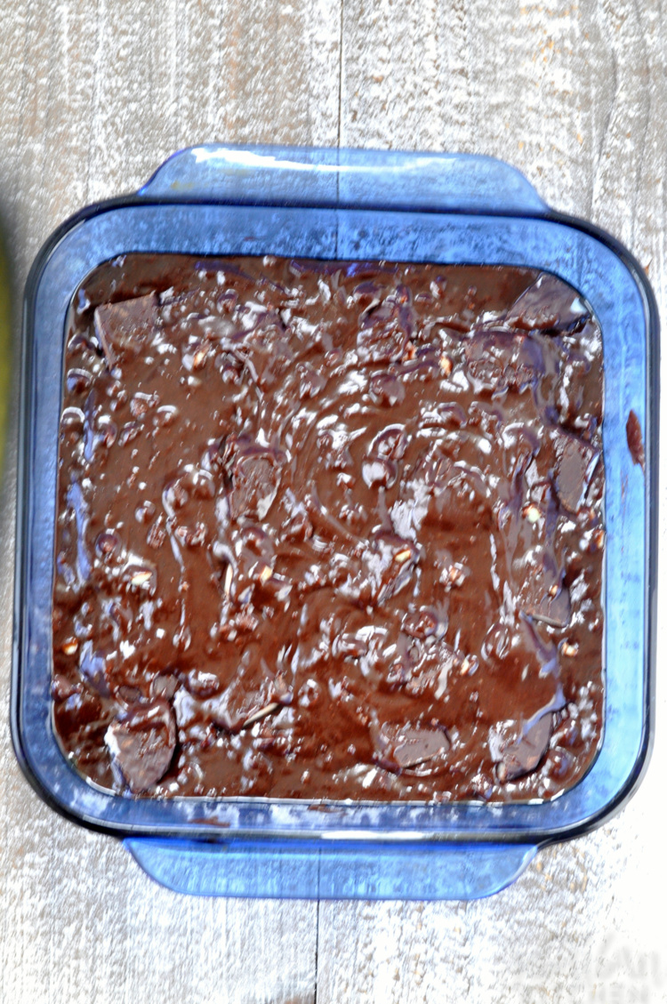 mint chocolate brownie batter in blue baking dish