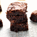 Photo of mint chocolate brownies on wood surface