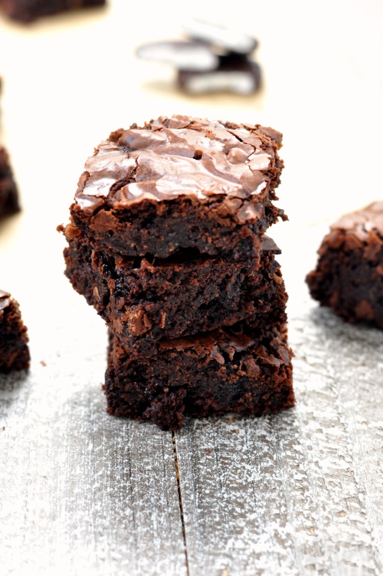 Photo of mint chocolate brownies on wood surface