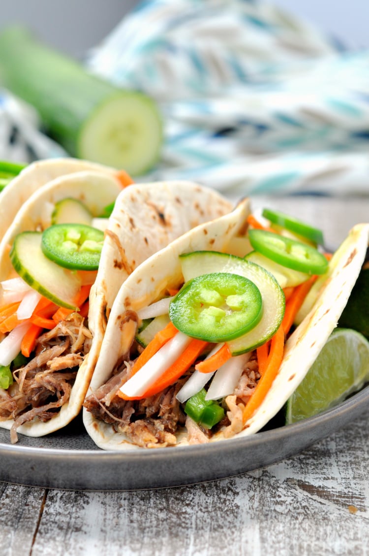 Front looking view of Vietnamese pork banh mi tacos on plate