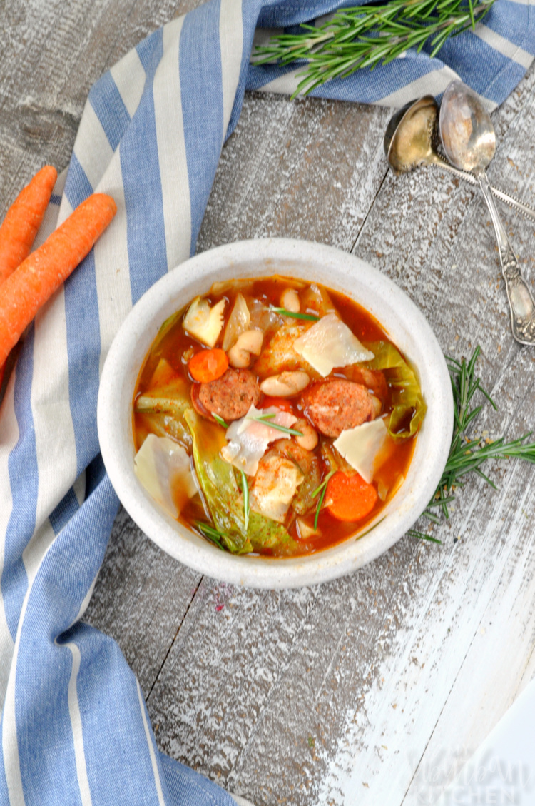 Best Cabbage Soup Recipe - overhead photo of soup in bowl with napkin and carrots