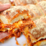 One pimento cheese pulled pork slider being held