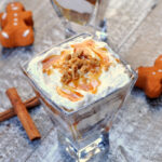 Gingerbread Cheesecake Trifle in glass with cinnamon sticks