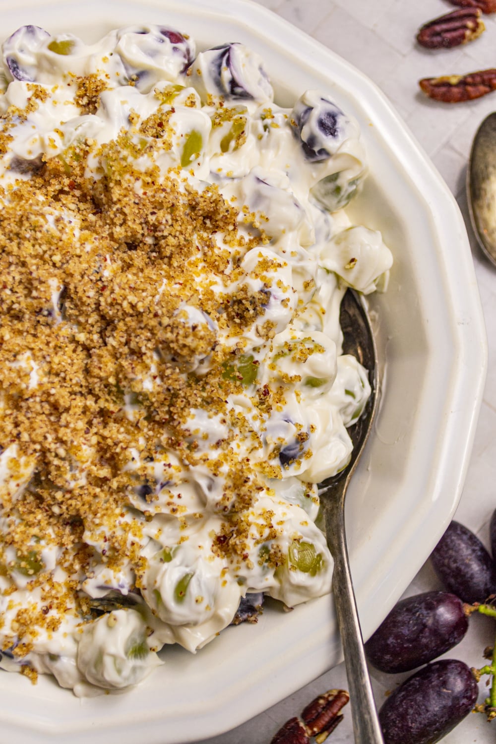 overhead photo of creamy grape salad with topping