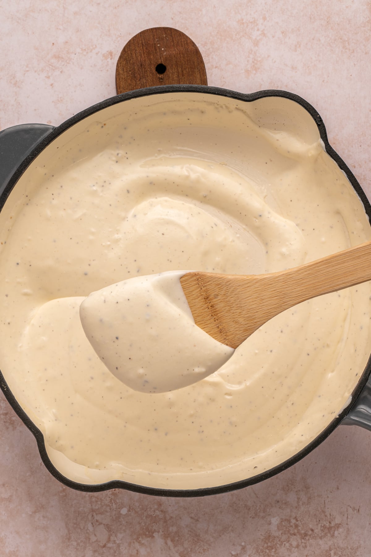 cottage cheese alfredo sauce on wooden spoon
